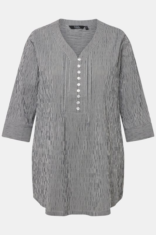 Tunique en tissu gaufré. Manches 3/4. Décolleté cœur et plis fantaisie