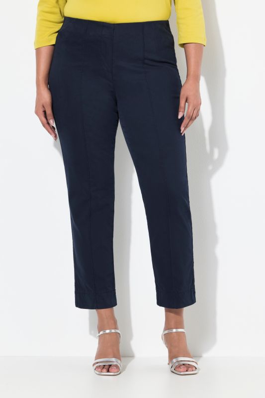 Pantalon, jambe slim. Taille élastique. Plis fantaisie. Petites fentes aux chevilles