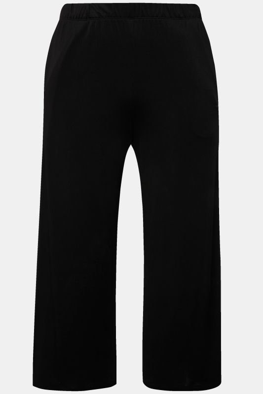 Jupe-culotte en maille fluide. Longueur mollet, jambe large. Taille élastique