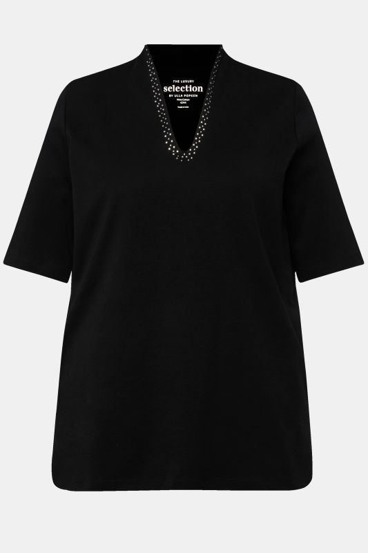 T-shirt à col cygne et manches courtes. Coupe évasée