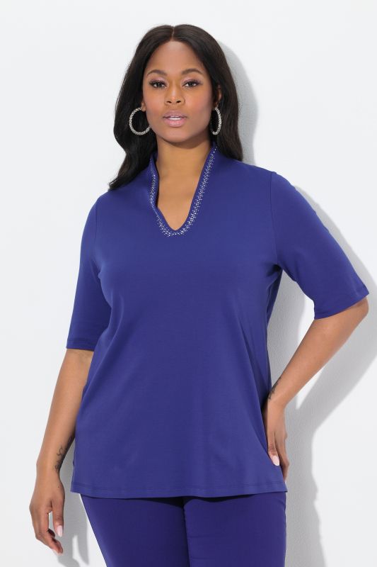 T-shirt à col cygne et manches courtes. Coupe évasée