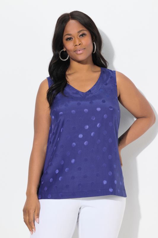 Blouse à pois jacquard avec encolure en V. Sans manches