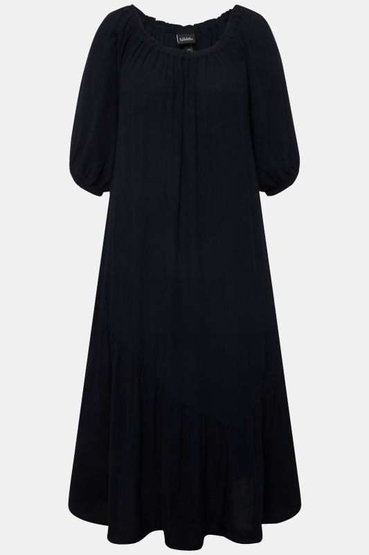 Robe midi à col rond et manches courtes. Base volantée et matière texturée