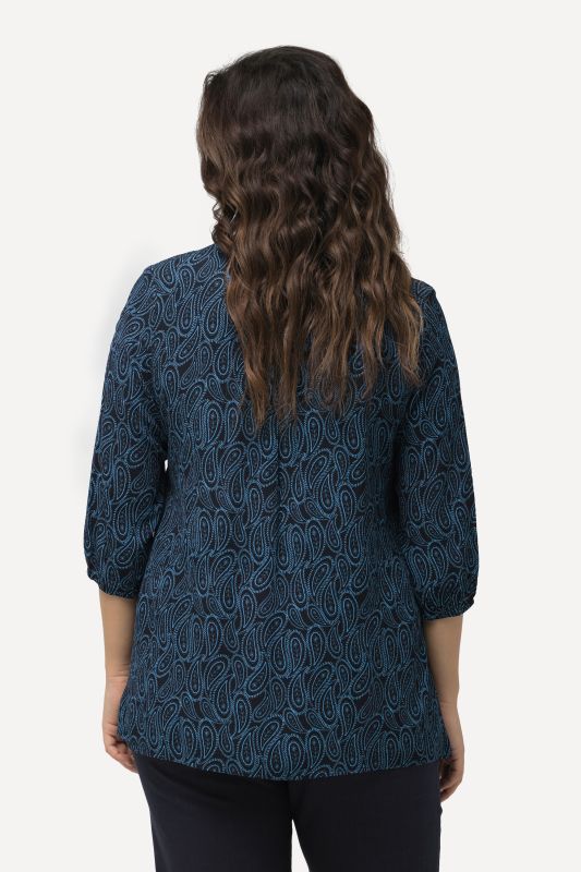 Blouse smockée avec encolure ronde et manches 3/4. Ligne A