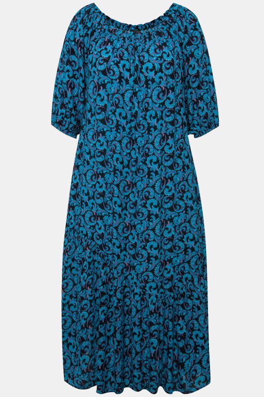Robe midi à col rond et manches courtes. Volant à la base et motif vrilles