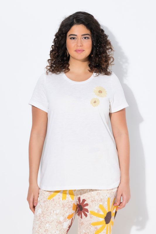 T-shirt en coton bio. Col rond et manches courtes. Motifs brodés