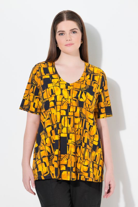 T-shirt en coton bio. Décolleté en V et manches courtes. Motif soleils