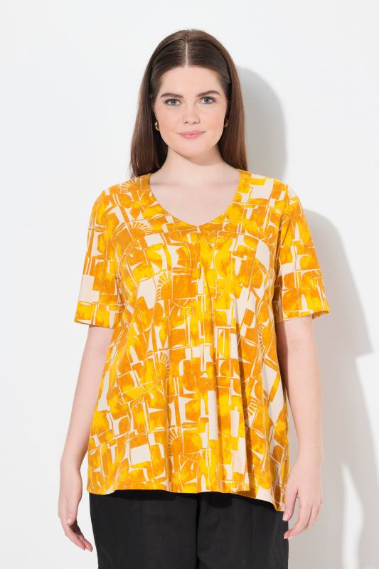 T-shirt en coton bio. Décolleté en V et manches courtes. Motif soleils