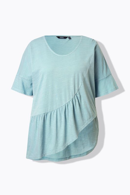 T-shirt oversize en coton bio. Col en V et manches courtes. Volant à la base