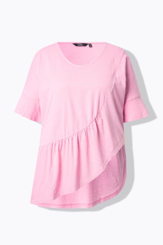T-shirt oversize en coton bio. Col en V et manches courtes. Volant à la base
