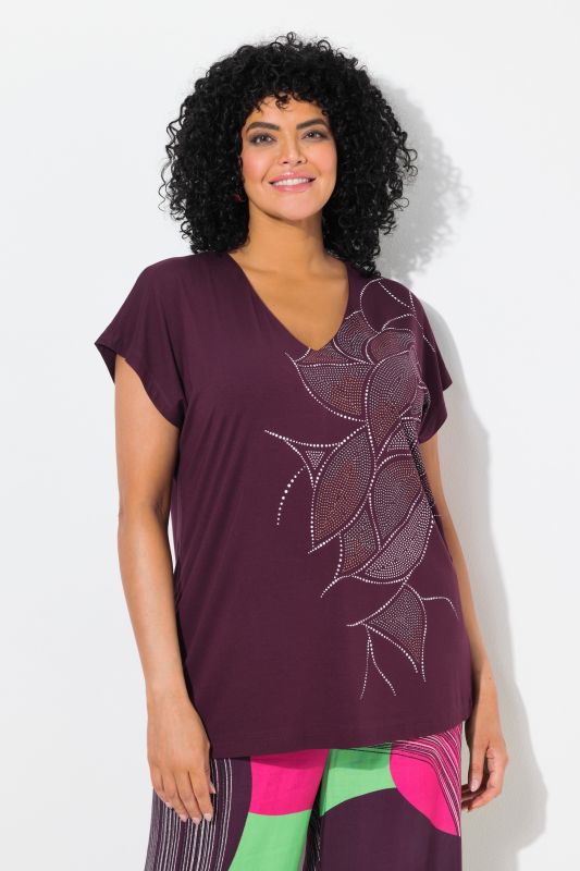 T-shirt oversize. Col en V et manches courtes. Imprimé chatoyant