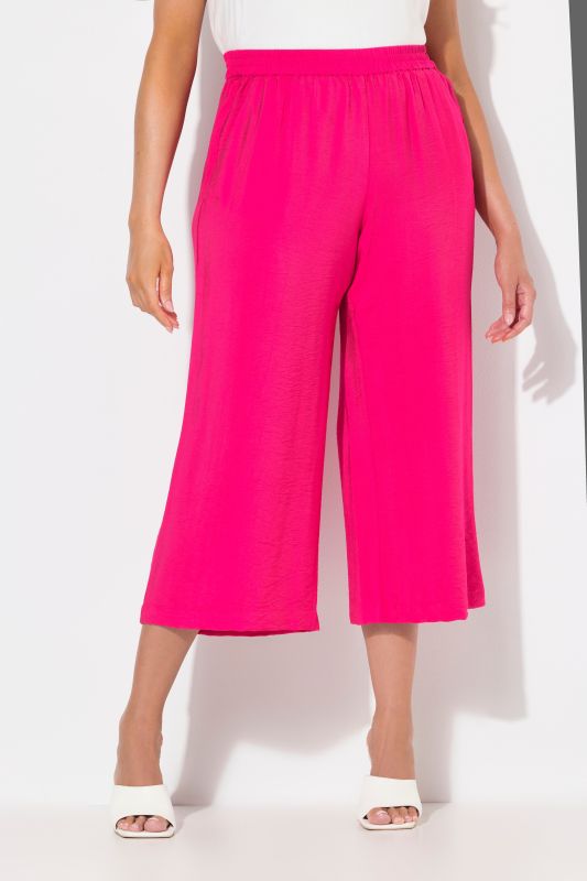 Jupe-culotte à jambe large et taille élastique. Tissu à texture irrégulière