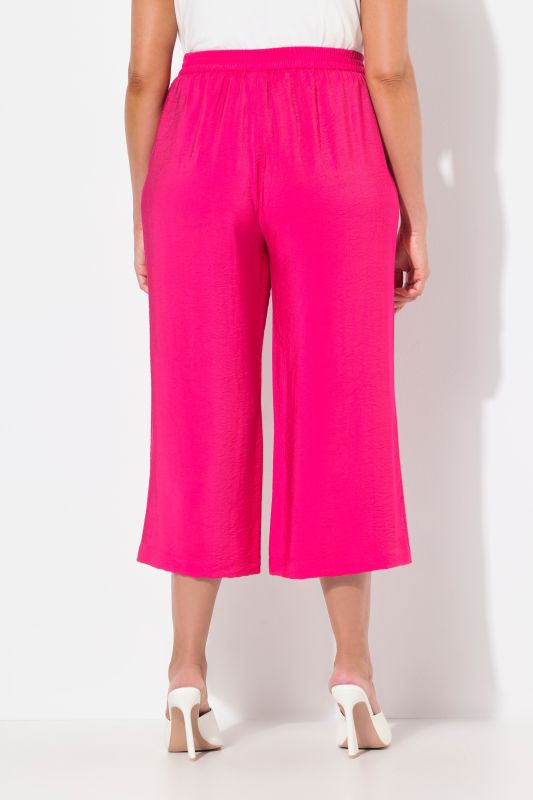 Jupe-culotte à jambe large et taille élastique. Tissu à texture irrégulière