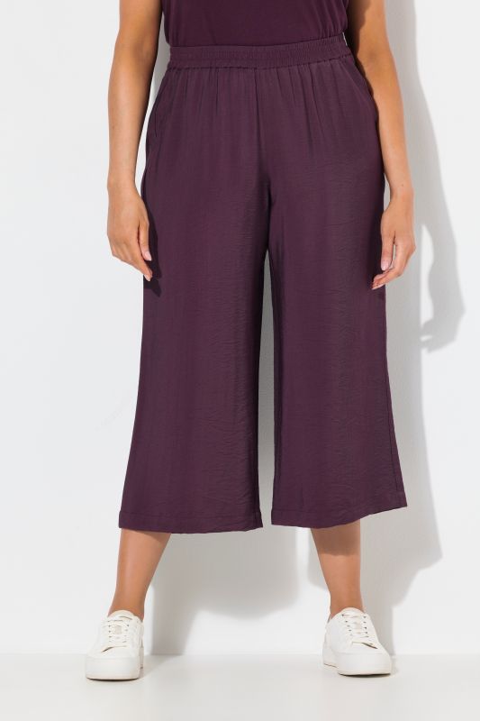 Jupe-culotte à jambe large et taille élastique. Tissu à texture irrégulière
