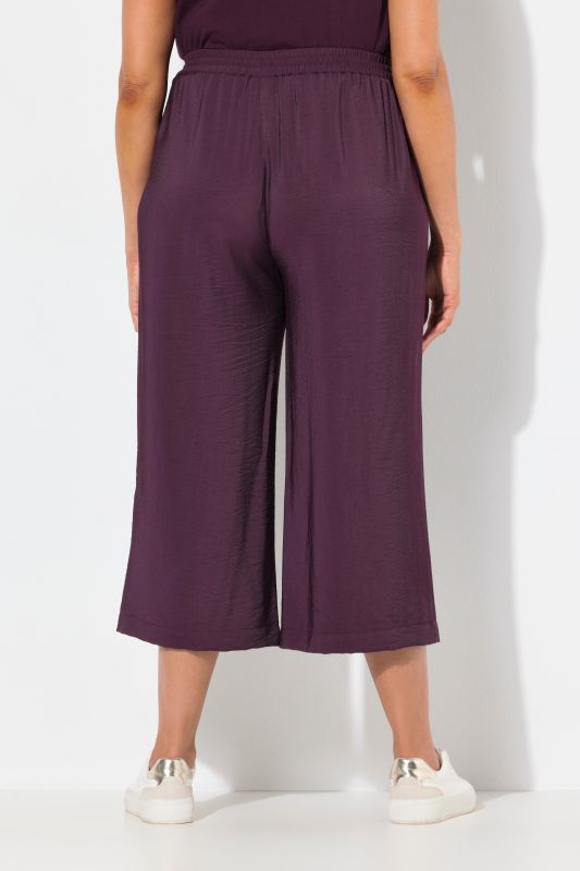 Jupe-culotte à jambe large et taille élastique. Tissu à texture irrégulière