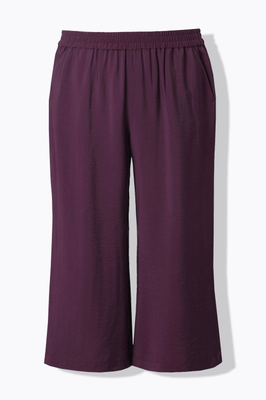 Jupe-culotte à jambe large et taille élastique. Tissu à texture irrégulière
