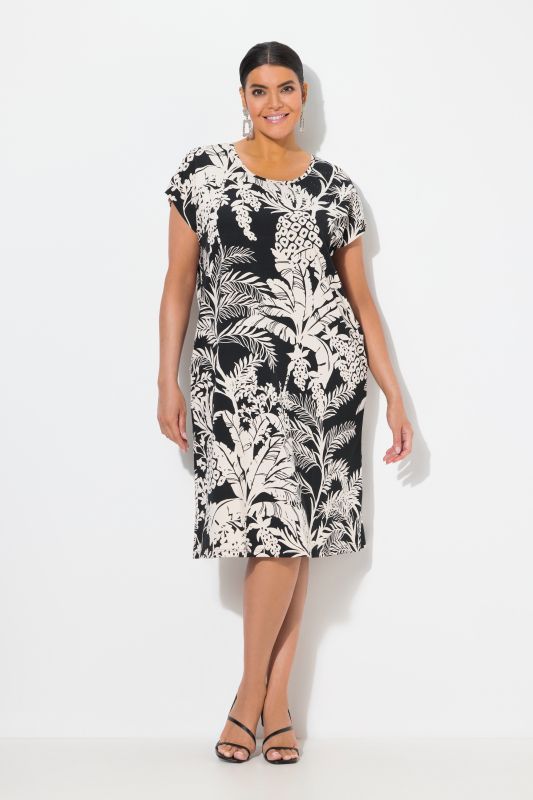 Robe oversize en jersey. Col rond et manches courtes. Imprimé palmiers