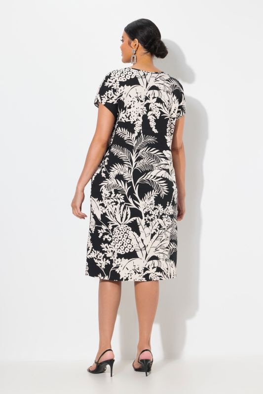 Robe oversize en jersey. Col rond et manches courtes. Imprimé palmiers