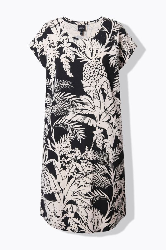 Robe oversize en jersey. Col rond et manches courtes. Imprimé palmiers