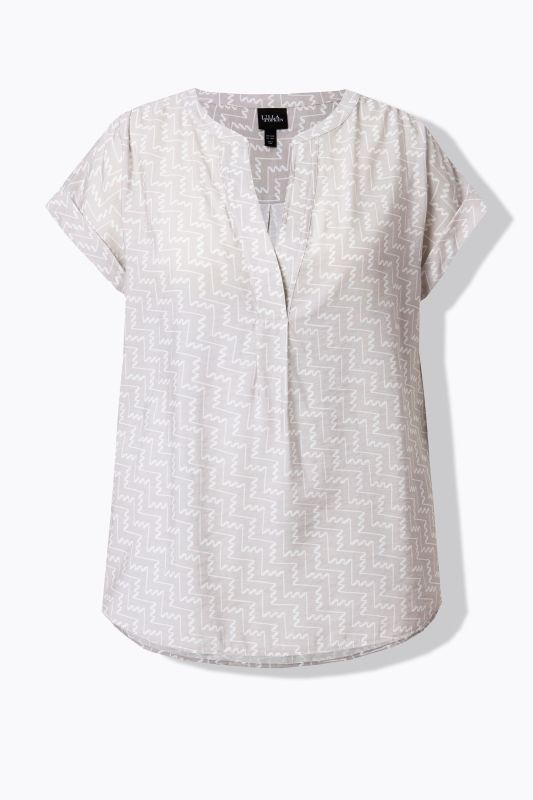 Blouse-tunique à imprimé graphique. Manches courtes et col tunisien