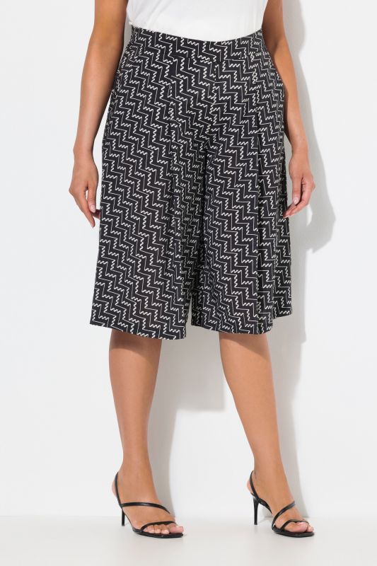 Jupe-culotte courte. Jambe large et taille confortable. Tissu à texture « martelée »