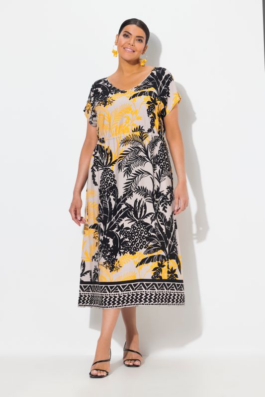 Robe maxi sans manches. Col en V et cordon de serrage. Imprimé palmiers