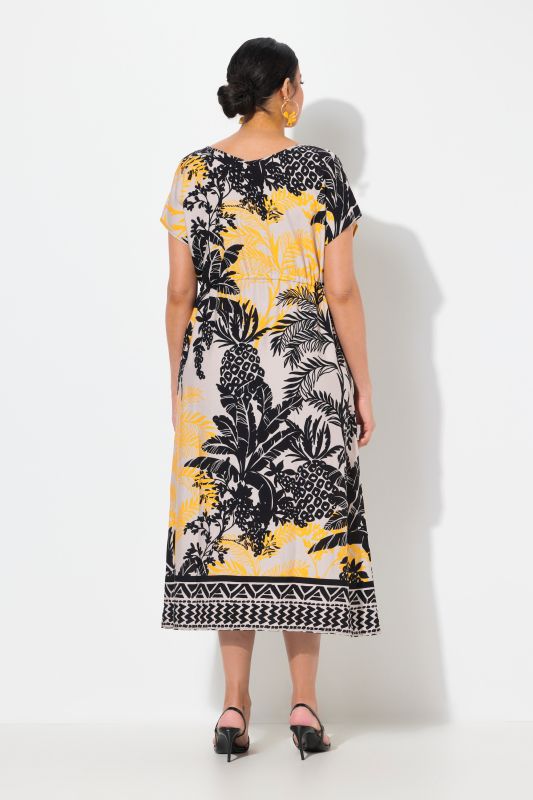 Robe maxi sans manches. Col en V et cordon de serrage. Imprimé palmiers
