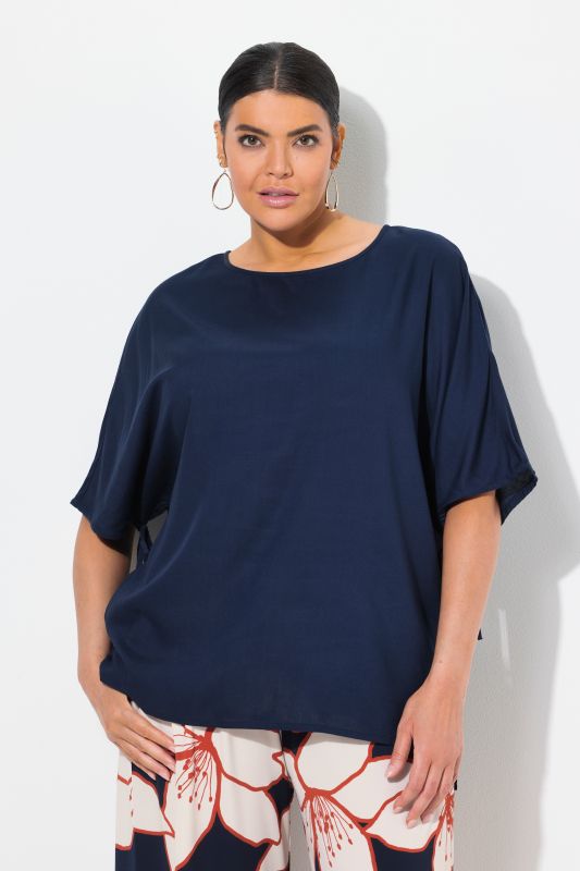 Blouse-tunique oversize. Col bateau et manches courtes