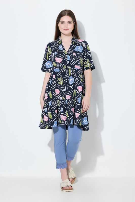 Blouse longue dans un imprimé à fleurs, coupe évasée, col polo et manches courtes
