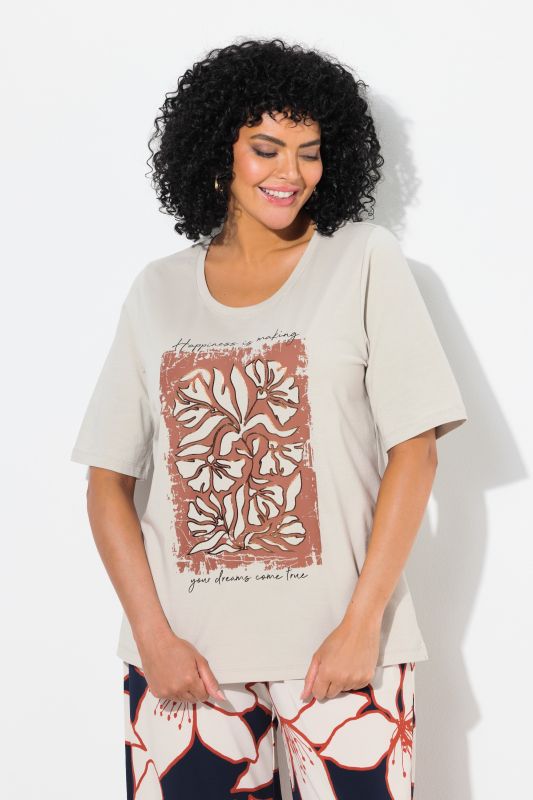 T-shirt à col rond et manches courtes. Imprimé fleurs à effet métallisé