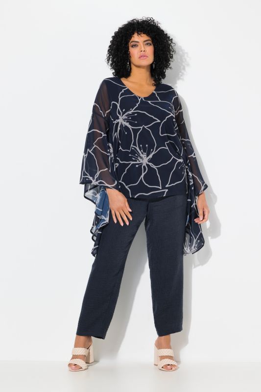 Blouse oversize à fleurs. Col en V et manches 3/4