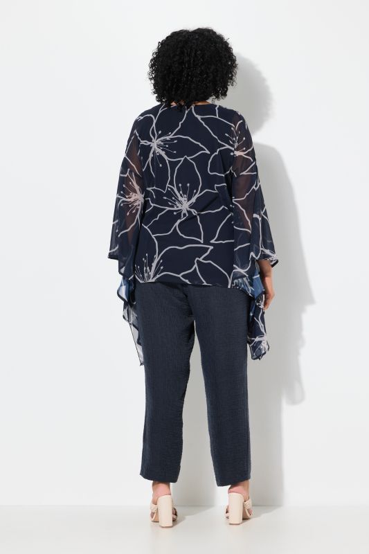 Blouse oversize à fleurs. Col en V et manches 3/4