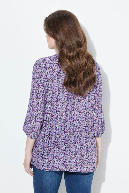 Blouse smockée, motif à fleurs, décolleté rond et manches 3/4, coupe évasée