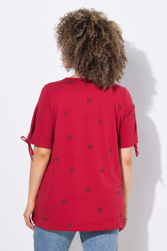 T-shirt coupe évasée, motif petits nœuds, décolleté en V et manches courtes