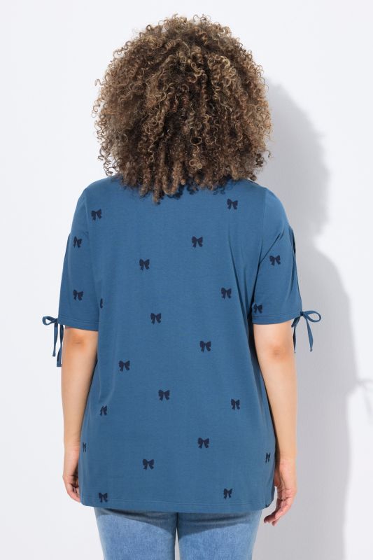 T-shirt coupe évasée, motif petits nœuds, décolleté en V et manches courtes