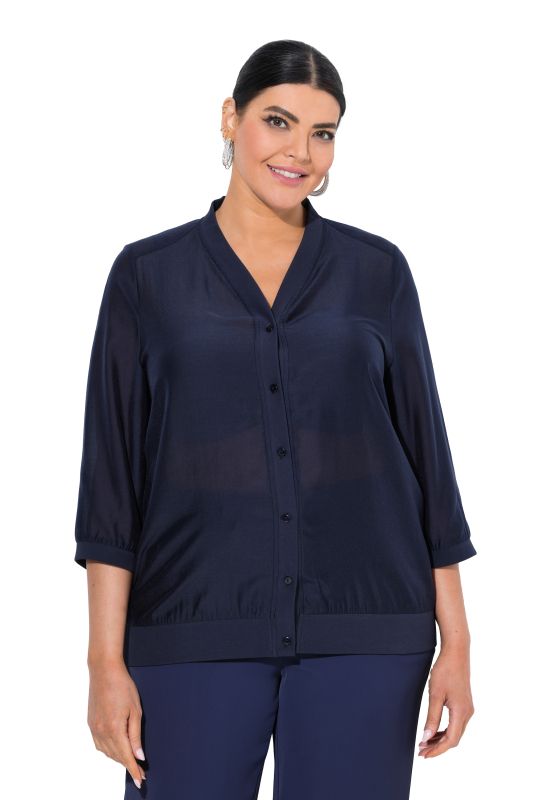 Blouse légèrement transparente, décolleté en V et manches 3/4
