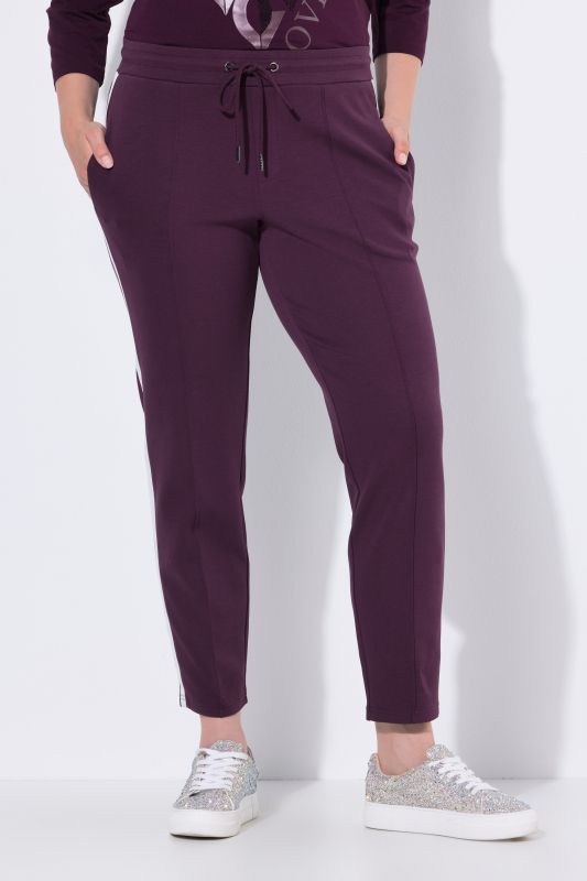 Pantalon point de Rome, jambe carotte et taille élastique, galon le long de la jambe
