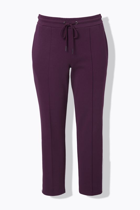 Pantalon point de Rome, jambe carotte et taille élastique, galon le long de la jambe