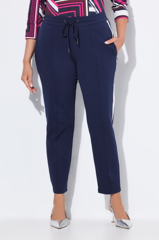 Pantalon point de Rome, jambe carotte et taille élastique, galon le long de la jambe