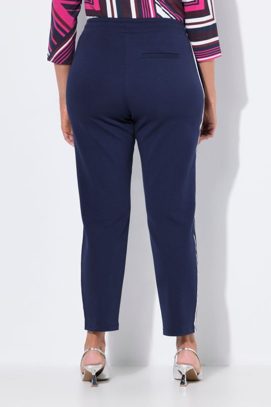 Pantalon point de Rome, jambe carotte et taille élastique, galon le long de la jambe