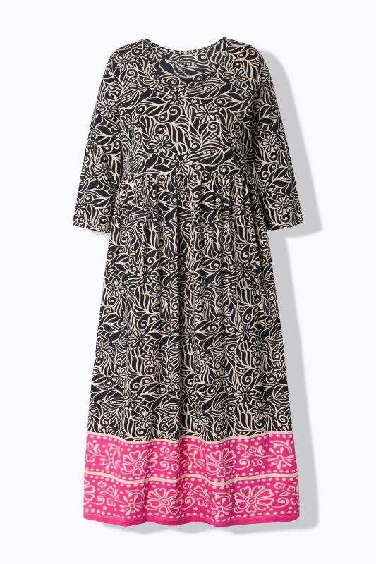 Robe en jersey. Col rond et manches 3/4. Poches et coupe évasée