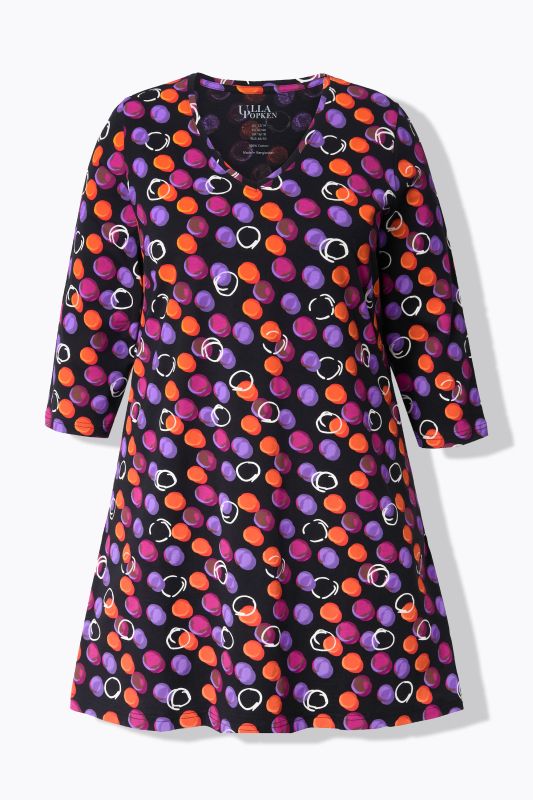 T-shirt long, motif à pois. Col en V et manches 3/4. Coupe évasée