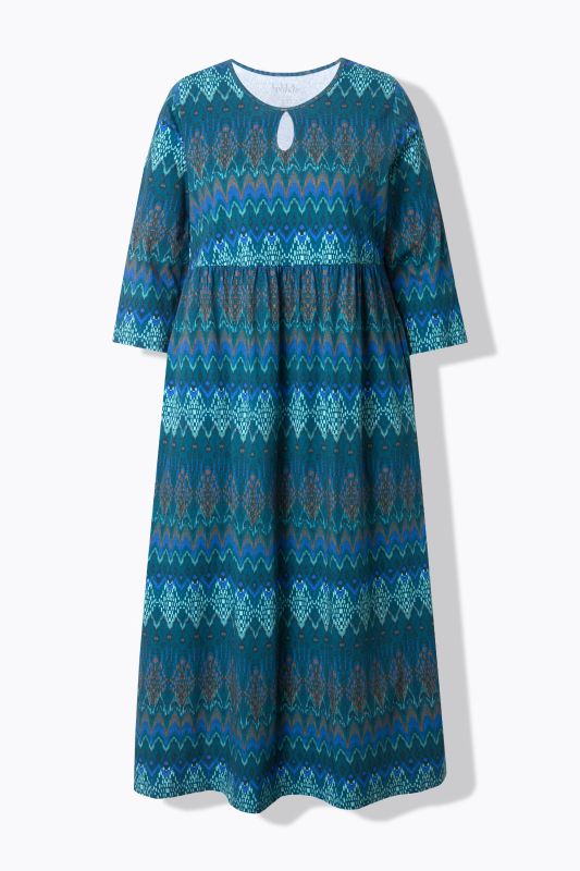 Robe en jersey, coupe évasée. Manches 3/4. Encolure à découpe en forme de goutte