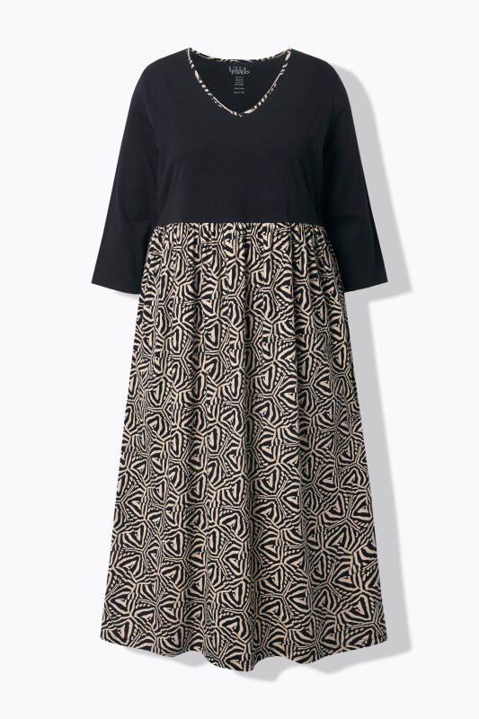 Robe en jersey, coupe évasée. Col en V et manches 3/4