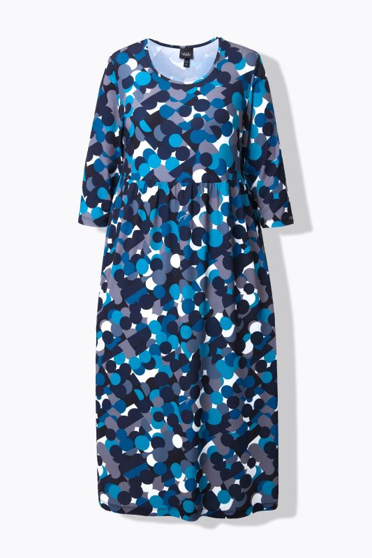 Robe en jersey, imprimé pois. Col rond et manches 3/4. Coupe évasée