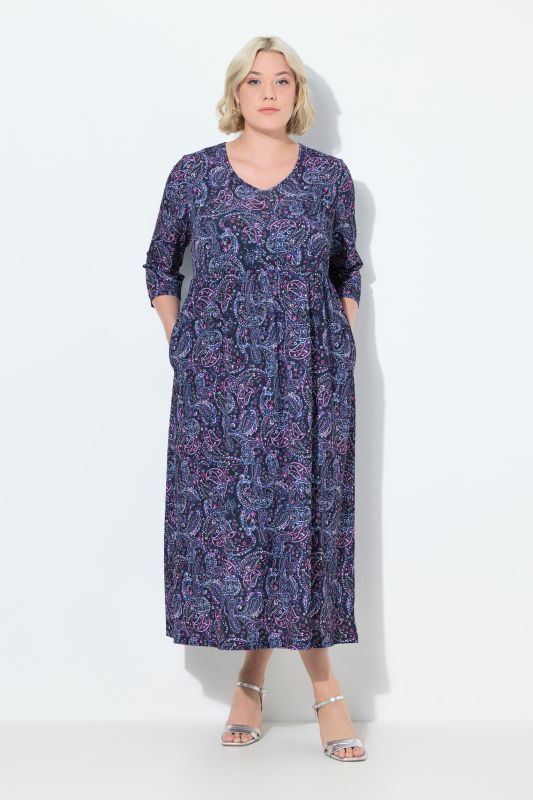Robe en jersey, coupe évasée. Col en V et manches 3/4