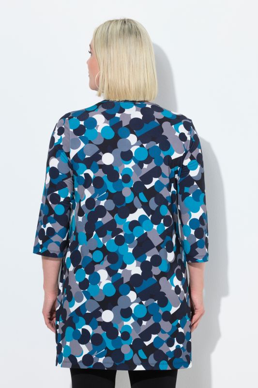 T-shirt long, motif à pois. Col en V et manches 3/4. Coupe évasée