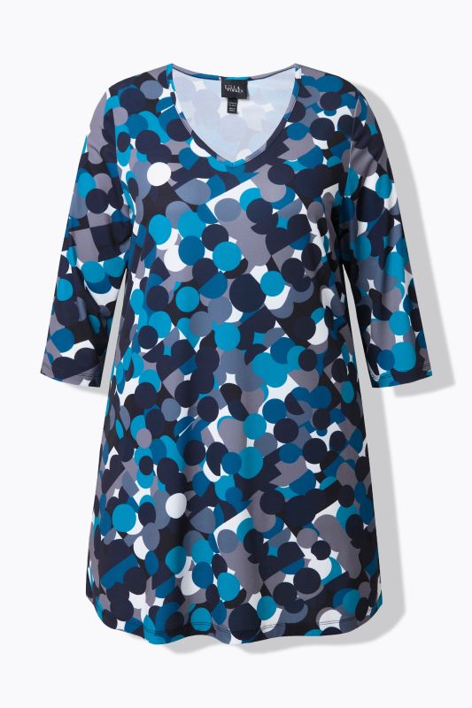 T-shirt long, motif à pois. Col en V et manches 3/4. Coupe évasée