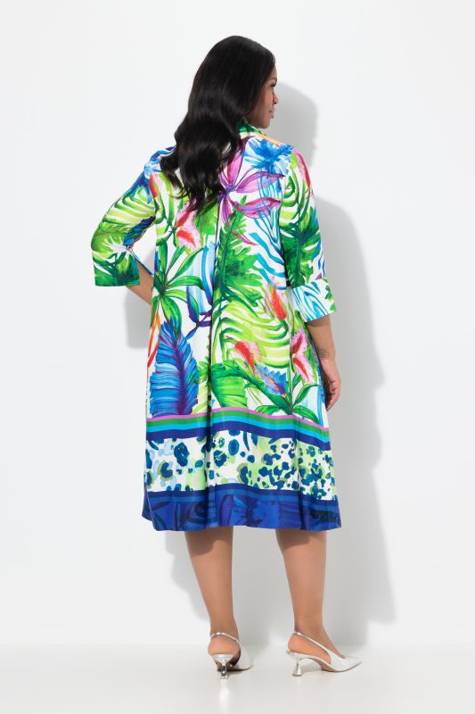 Robe midi en satin. Motif feuilles et coupe évasée. Manches 3/4 et col chemise