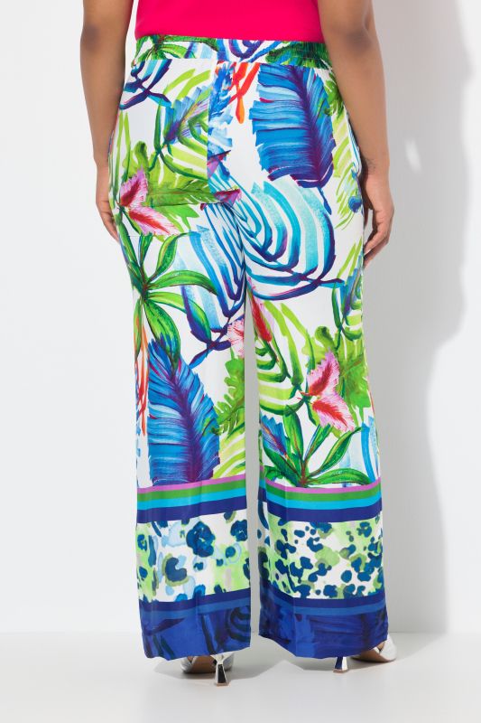 Pantalon en satin à taille élastique. Jambe droite et large. Imprimé feuilles